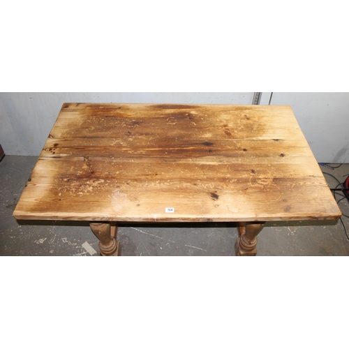 164 - A rustic pine farmhouse kitchen table, approx 150cm x 84cm