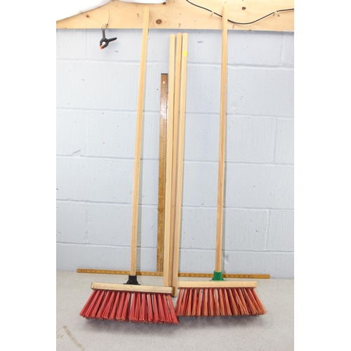 832 - 2 yard brooms with 3 spare handles