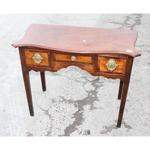 173 - A 19th century mahogany lowboy with decorative brass handles with 3 drawers, approx 90cm wide