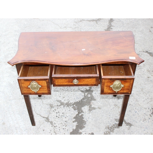 173 - A 19th century mahogany lowboy with decorative brass handles with 3 drawers, approx 90cm wide