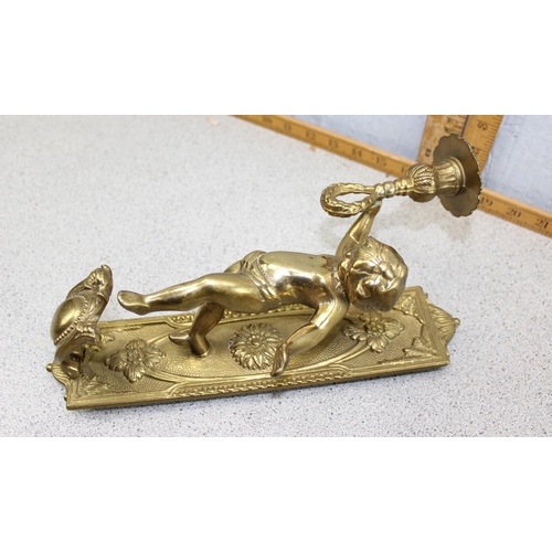 1852 - A pair of classical style brass wall sconces designed as cherubs holding a torch