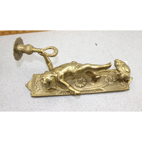 1852 - A pair of classical style brass wall sconces designed as cherubs holding a torch