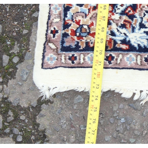 212 - Hand tied blue and cream ground rug with floral border