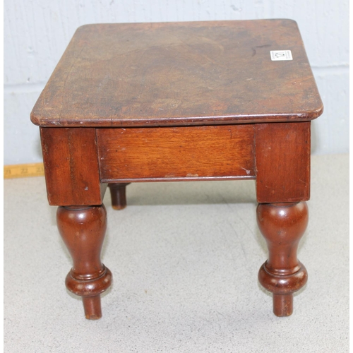 121 - A small antique mahogany low stool with turned legs