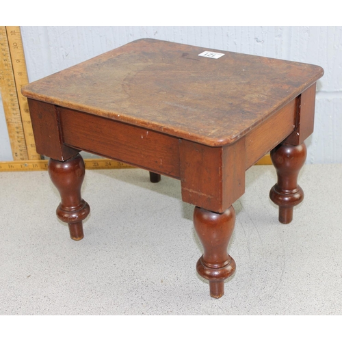 121 - A small antique mahogany low stool with turned legs