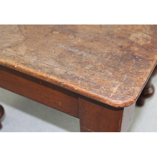 121 - A small antique mahogany low stool with turned legs