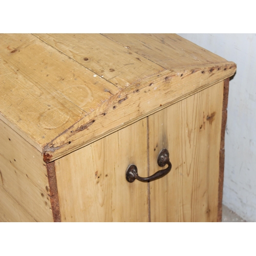 23 - A large Victorian dome topped pine trunk with iron handles, approx 115cm wide