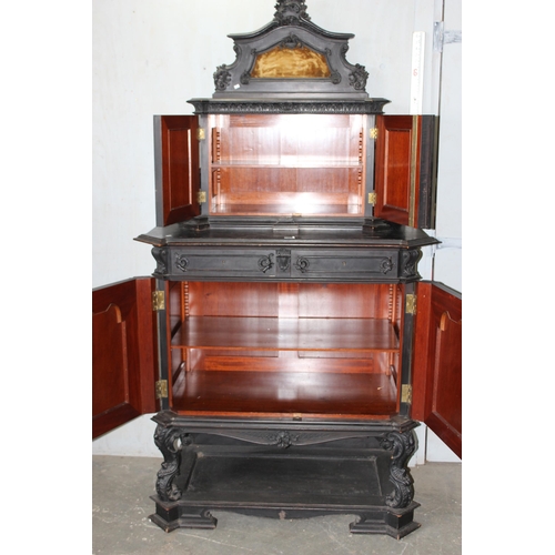 24 - A 19th century Continental ebonised and profusely carved 2 tier buffet cabinet in the German Renaiss... 