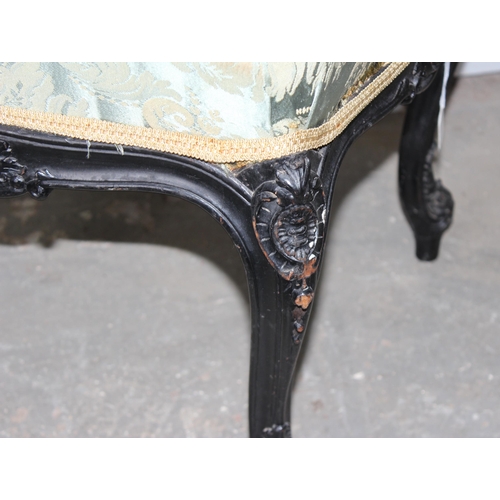 27 - A 19th century Continental ebonised and profusely carved stool with stuffed green fabric top in the ... 