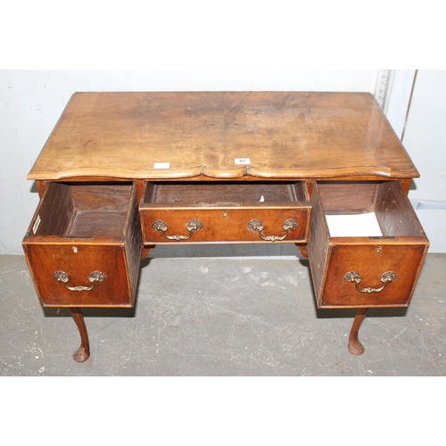 65 - An 18th century style lowboy with brass drop handles and cabriole legs by Kerridges of Hailsham, app... 