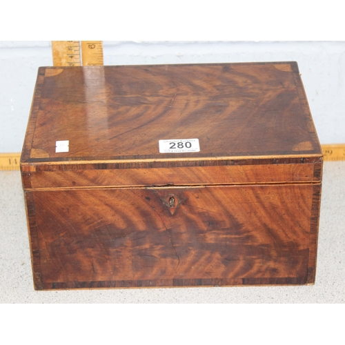 280 - An antique mahogany stationary box with brass lion head handles