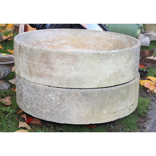 317 - A pair of thin concrete garden planters, approx 60cm diameter