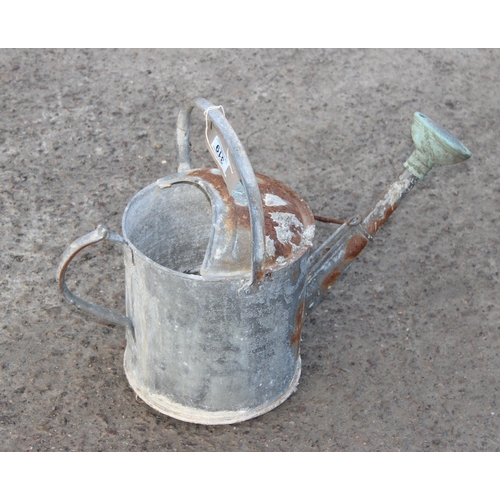 319 - Vintage galvanised watering can with rose