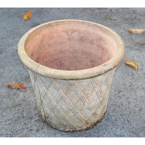 345 - A terracotta garden pot with basket type decoration, approx 48cm in diameter