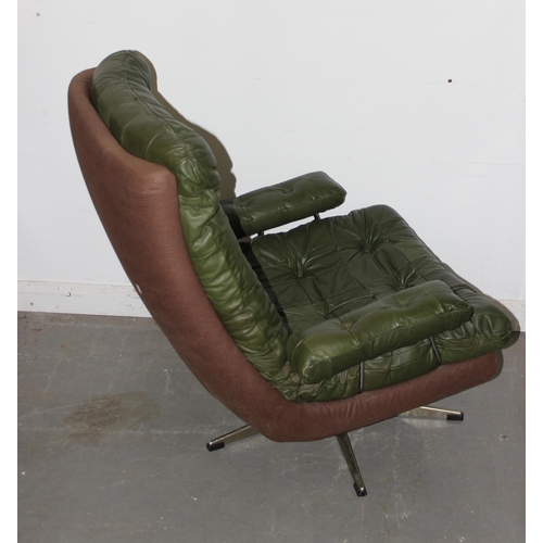 37 - A retro Scandinavian style armchair with green buttoned upholstery, possibly leather, unmarked but c... 