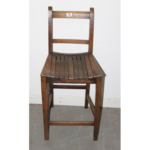 38 - A vintage wooden slatted child's correction chair