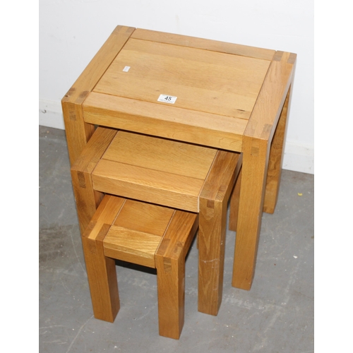 45 - A good quality modern light oak nest of 3 tables, believed to be Oak Furnitureland