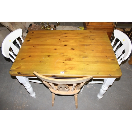 48 - A white painted pine farmhouse country kitchen dining table, approx 124cm x 87cm and 3 chairs, 2 pai... 