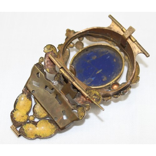 101A - A 19th century gilt metal cuff bangle with Grand Tour style micro mosaic panel depicting a classical... 