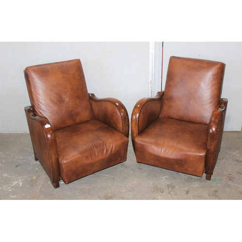 1 - A pair of Art Deco style light brown faux leather and wooden framed library or club chairs with stud... 