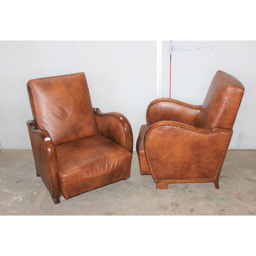 1 - A pair of Art Deco style light brown faux leather and wooden framed library or club chairs with stud... 