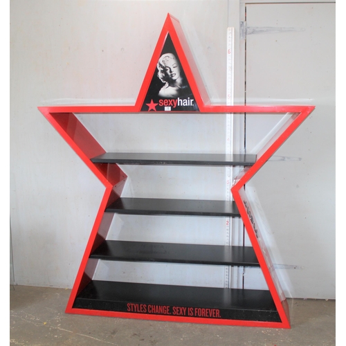 15 - A large painted metal shop display shelf decorated in the form of a star 