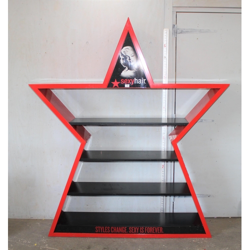 15 - A large painted metal shop display shelf decorated in the form of a star 