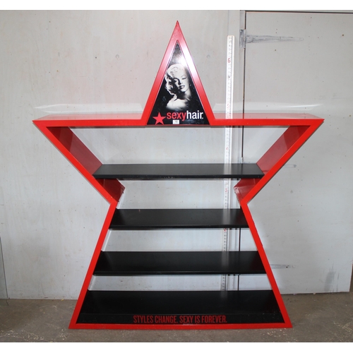 15 - A large painted metal shop display shelf decorated in the form of a star 