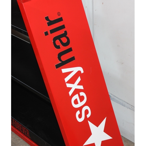 15 - A large painted metal shop display shelf decorated in the form of a star 