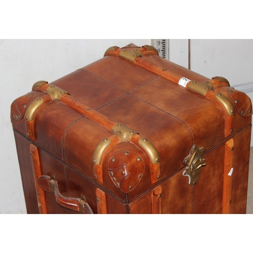 2 - A vintage style leather, brass and wooden storage trunk table, approx 48cm square