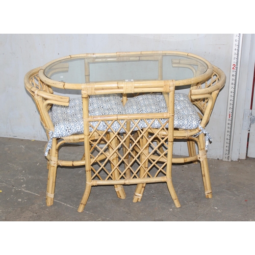 20 - 2 vintage bamboo chairs and a bistro table, possibly by Bruna Boho of Italy