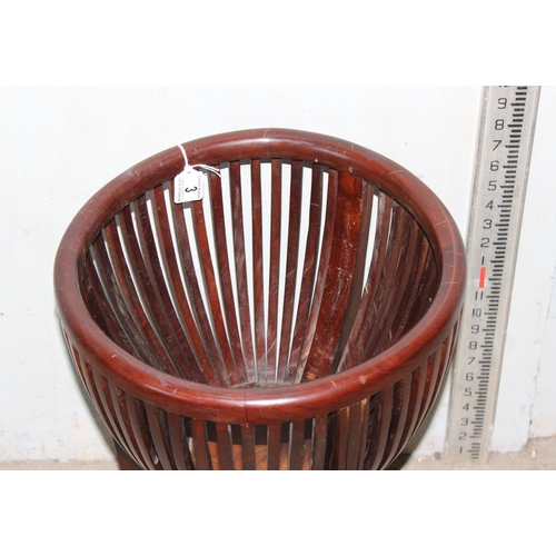 3 - A slatted wooden basket or plant holder on legs