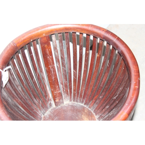 3 - A slatted wooden basket or plant holder on legs