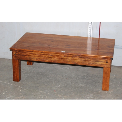 39 - Hardwood coffee table, approx 110cm wide