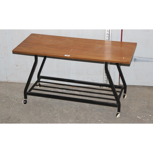 43 - Retro wooden top coffee table with metal wheeled base