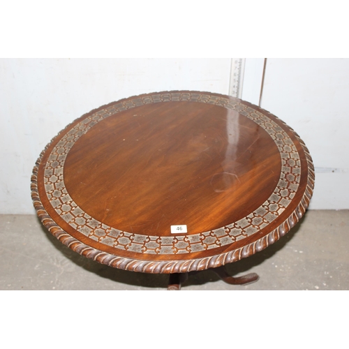 46 - Antique mahogany tilt top table with carved detail, approx diameter 80cm