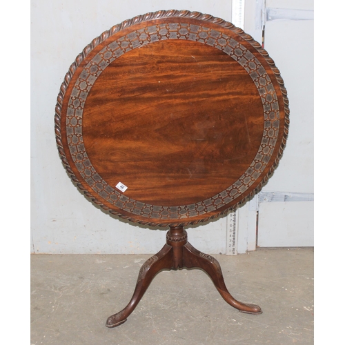 46 - Antique mahogany tilt top table with carved detail, approx diameter 80cm