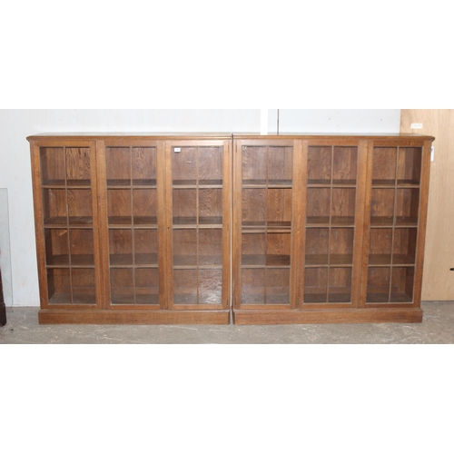 47 - A large early 20th century glazed oak bookcase, in two parts, approx 280cm wide