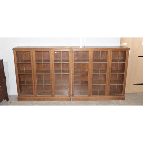 47 - A large early 20th century glazed oak bookcase, in two parts, approx 280cm wide