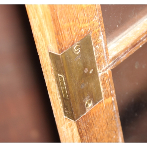 47 - A large early 20th century glazed oak bookcase, in two parts, approx 280cm wide