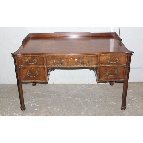 49 - Large antique mahogany serpentine fronted desk with good carved detail, oak lined draws & brass cast... 