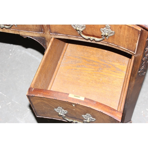 49 - Large antique mahogany serpentine fronted desk with good carved detail, oak lined draws & brass cast... 