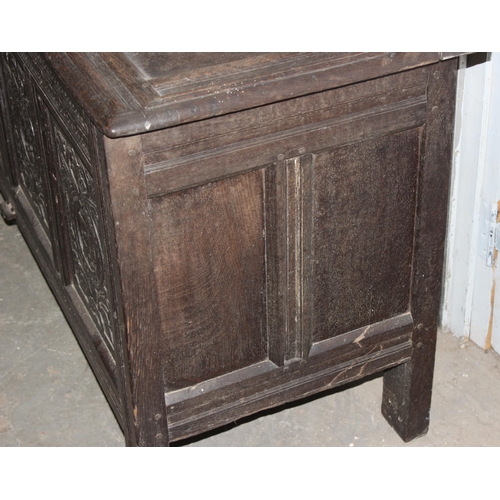 55 - 18th century oak coffer with 4 carved panels depicting faces and period iron work, approx. width 170... 