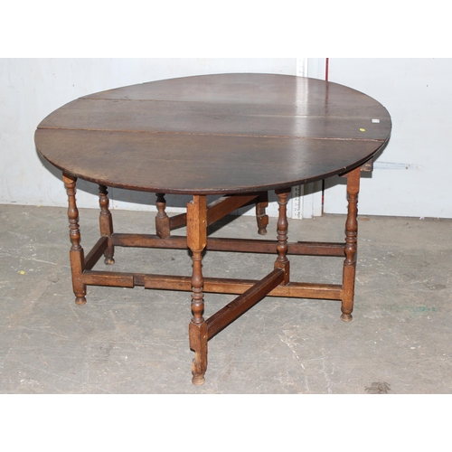 7 - An 18th century oak dropleaf table with drawer, approx 127cm wide (155cm when extended)