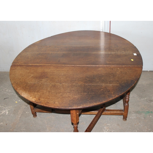 7 - An 18th century oak dropleaf table with drawer, approx 127cm wide (155cm when extended)