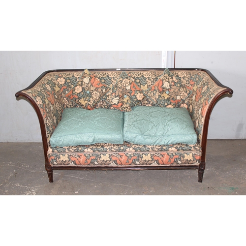 72 - An antique wooden framed couch or love seat with carved details and William Morris style upholstery ... 