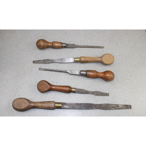 857 - Mixed box of very large screwdrivers, chisels & a rifle stock, to include Marples & Sons.