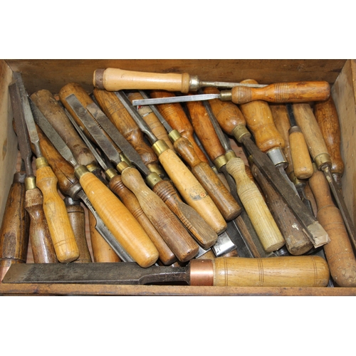 858 - Vintage wooden tool box full of wooden handled chisels, to include examples by Marples