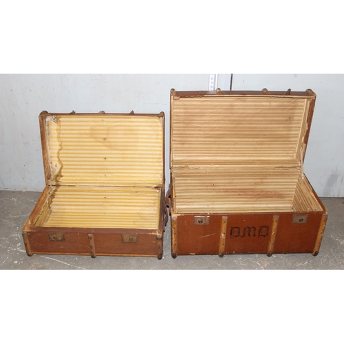 73 - 2 vintage wooden and canvas covered trunks