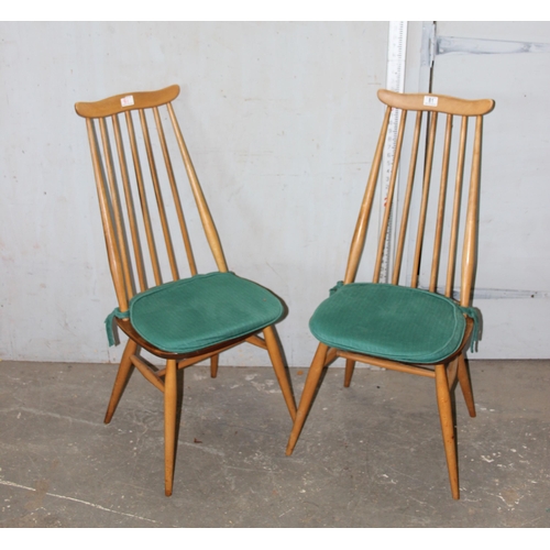 81 - A pair of Ercol Goldsmith pattern dining chairs, blonde finish